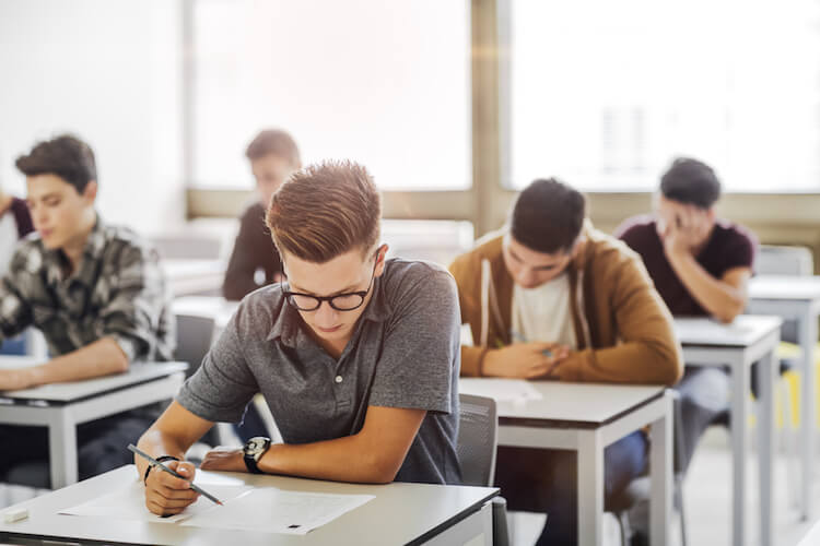 kids completing exam kids completing exam